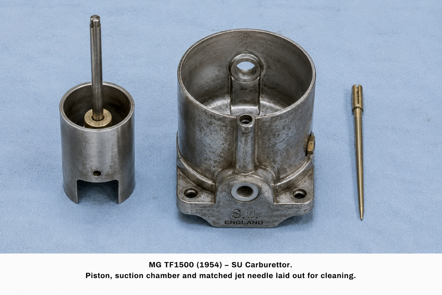 MG TF1500 (1954) — SU Carburettor piston, suction chamber and matched needle laid out for cleaning