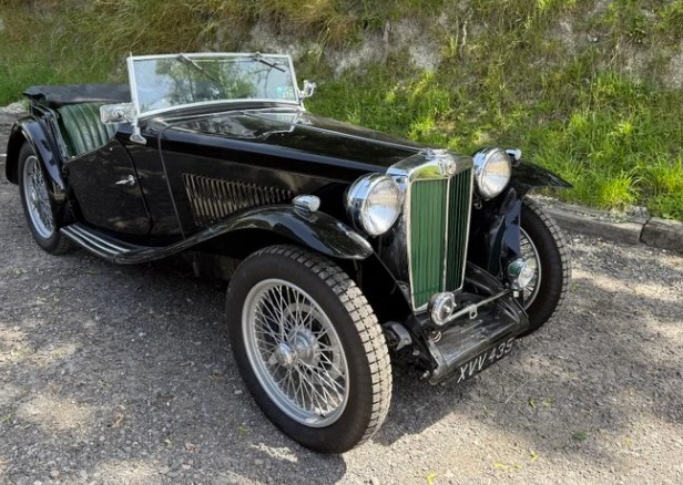 MG TC in black with chrome wire wheels — concours-standard restoration.