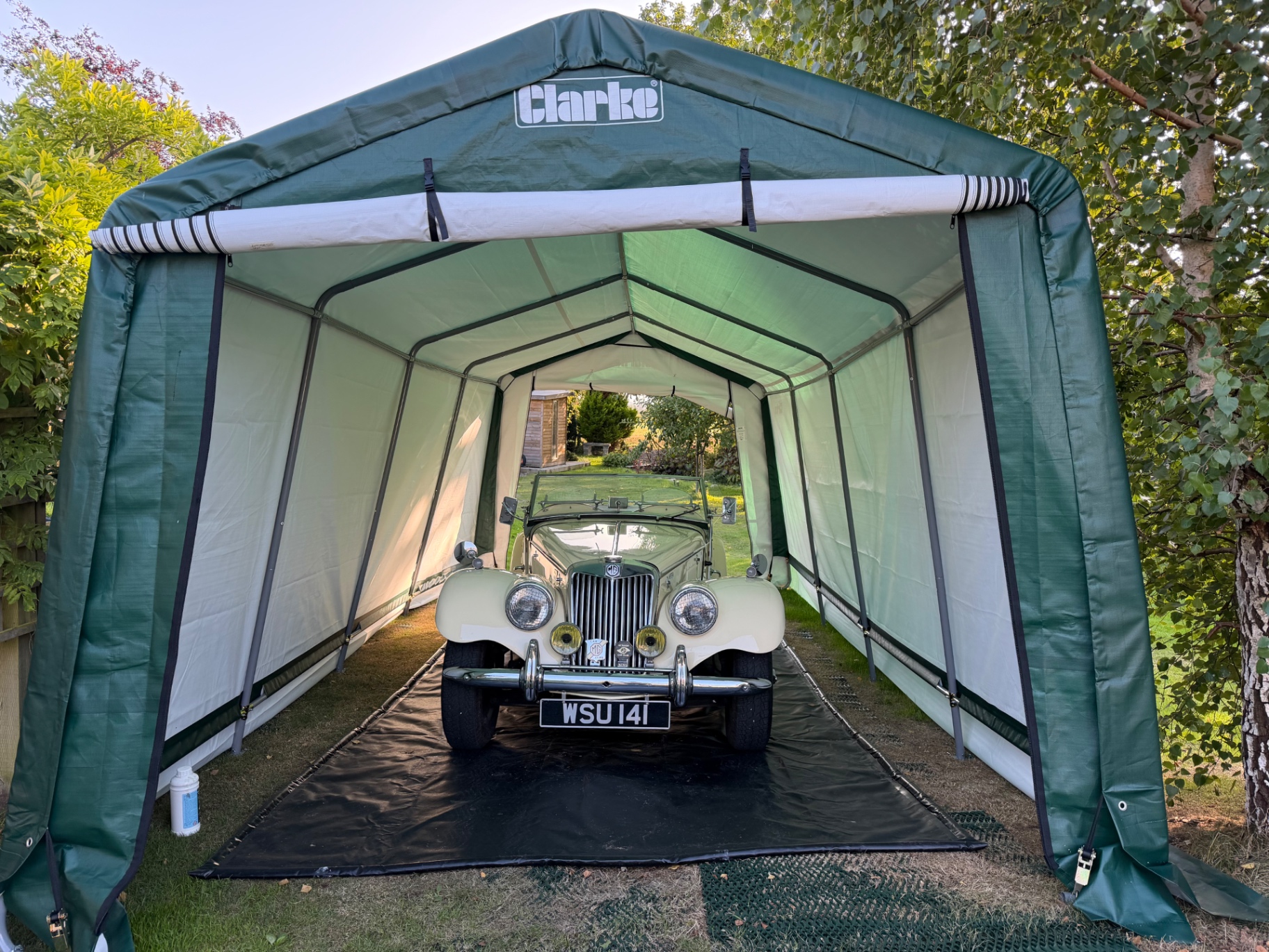 WSU 141, a 1954 MG TF 1500, under a Clarke portable shelter - front view