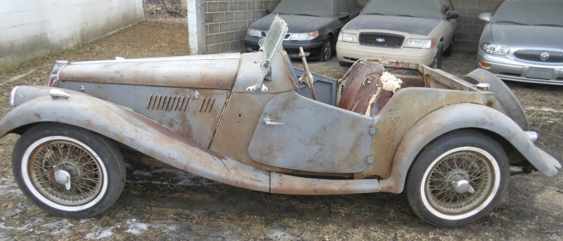 MG TD project car — weathered original paint, dry-stored, awaiting restoration.