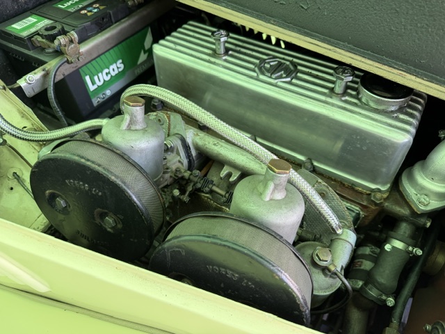 Close-up of the twin SU carburettors with pancake air cleaners on a cream MG TF 1500 XPEG engine