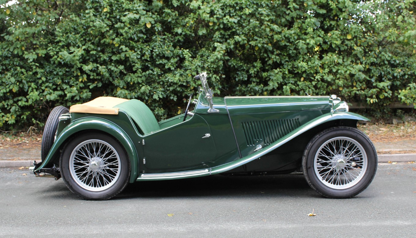 A 1945 MG TC in British Racing Green with a tan hood — the first postwar MG and the car that launched the US sports-car boom.