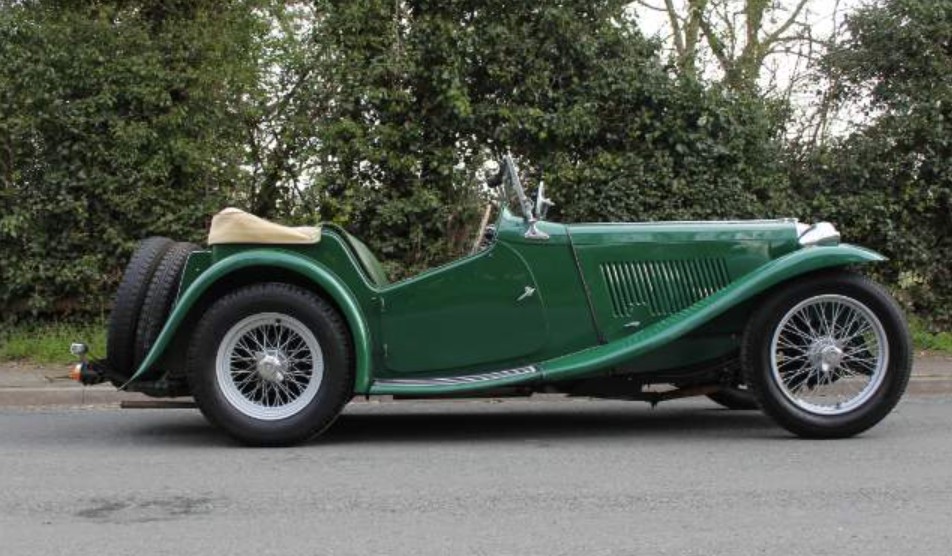 Side view of an MG TA in British Racing Green with a tan hood