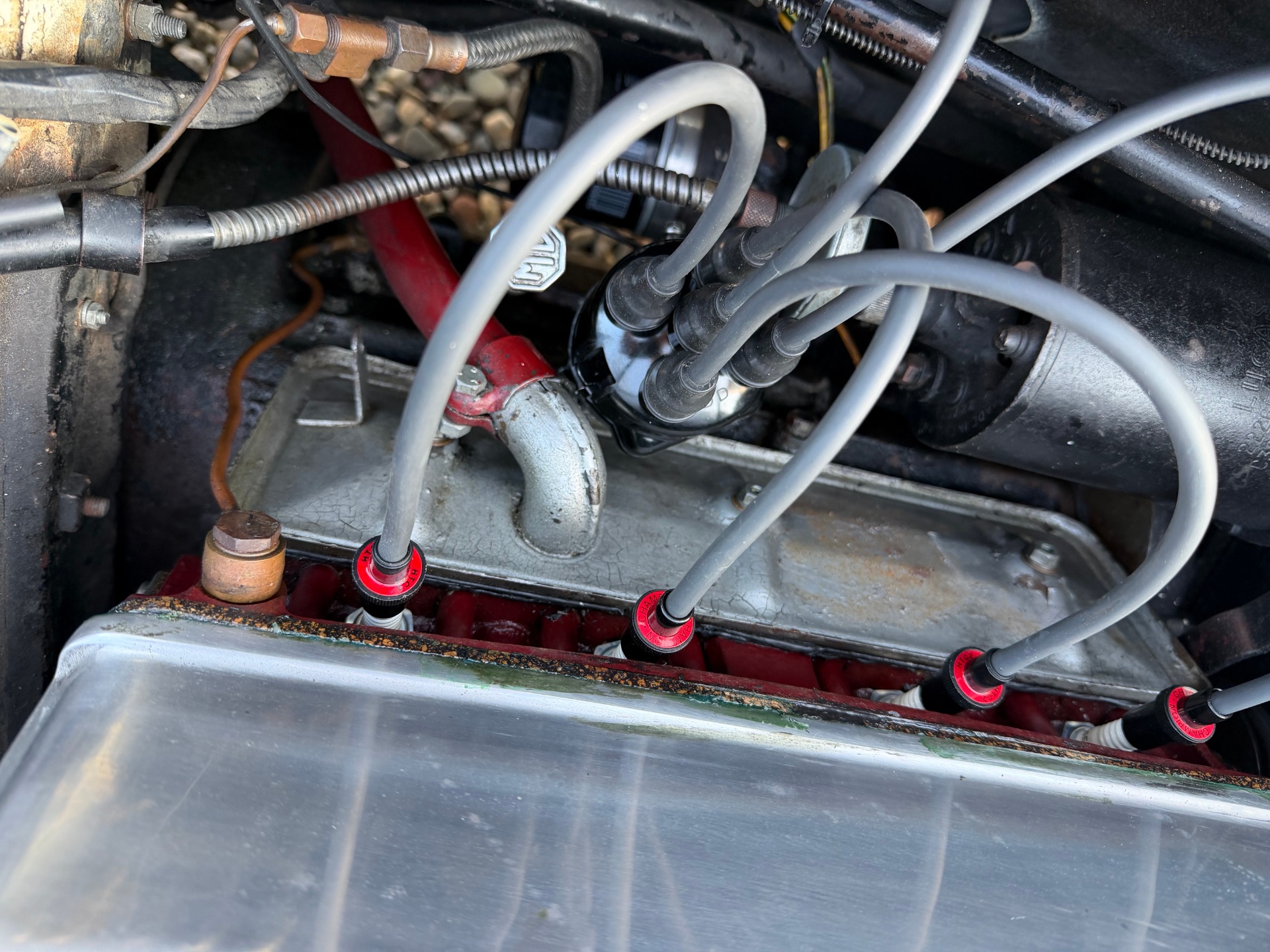 The correctly specified and recurved Lucas distributor as fitted, with copper-core HT leads and period screw-in acorn terminals to original specification.