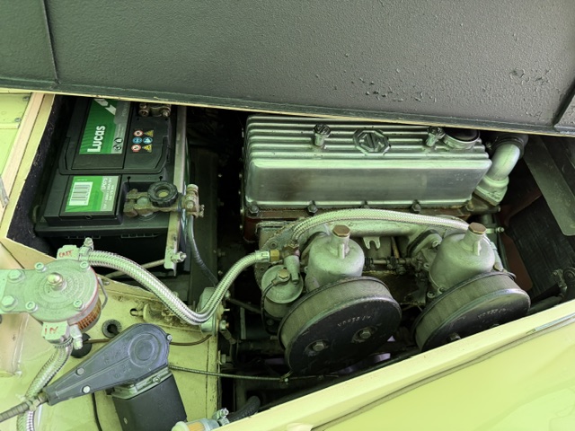The engine bay of the author's TF 1500, showing the XPEG with its twin SU carburettors, Lucas dynamo and standard rocker cover.