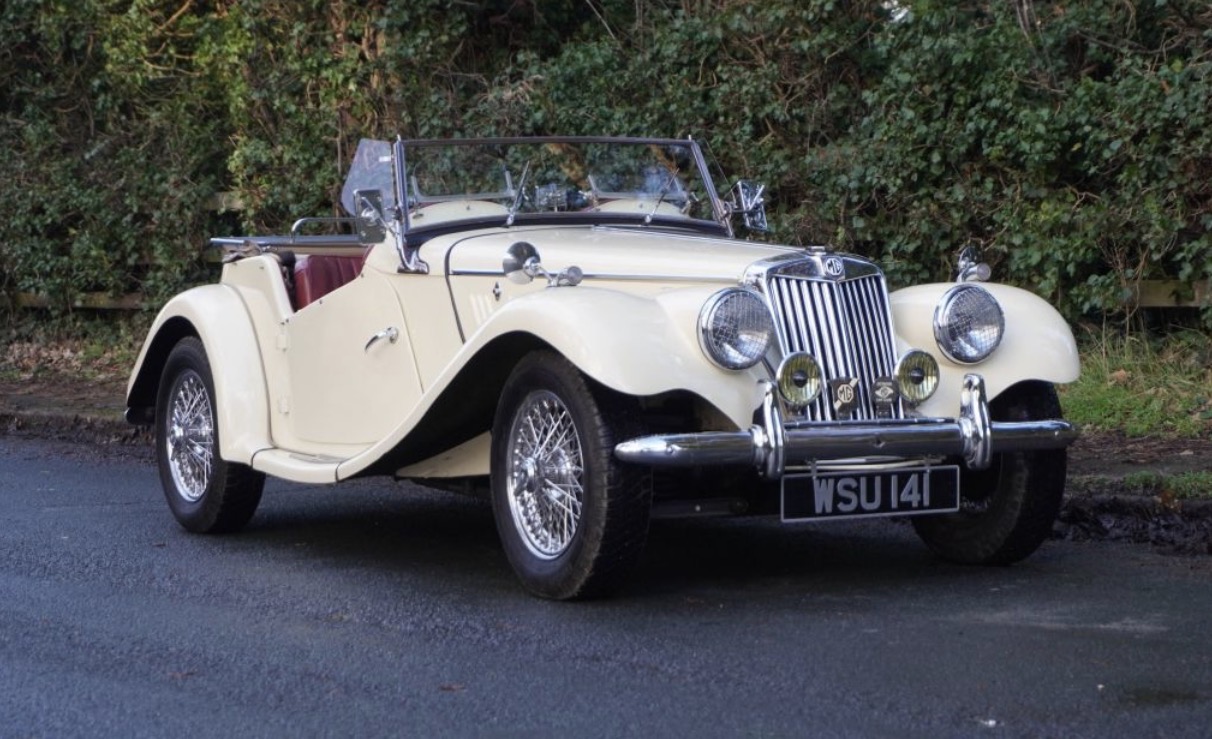 Cream MG TF 1500 sports car parked on a country lane, three-quarter front view