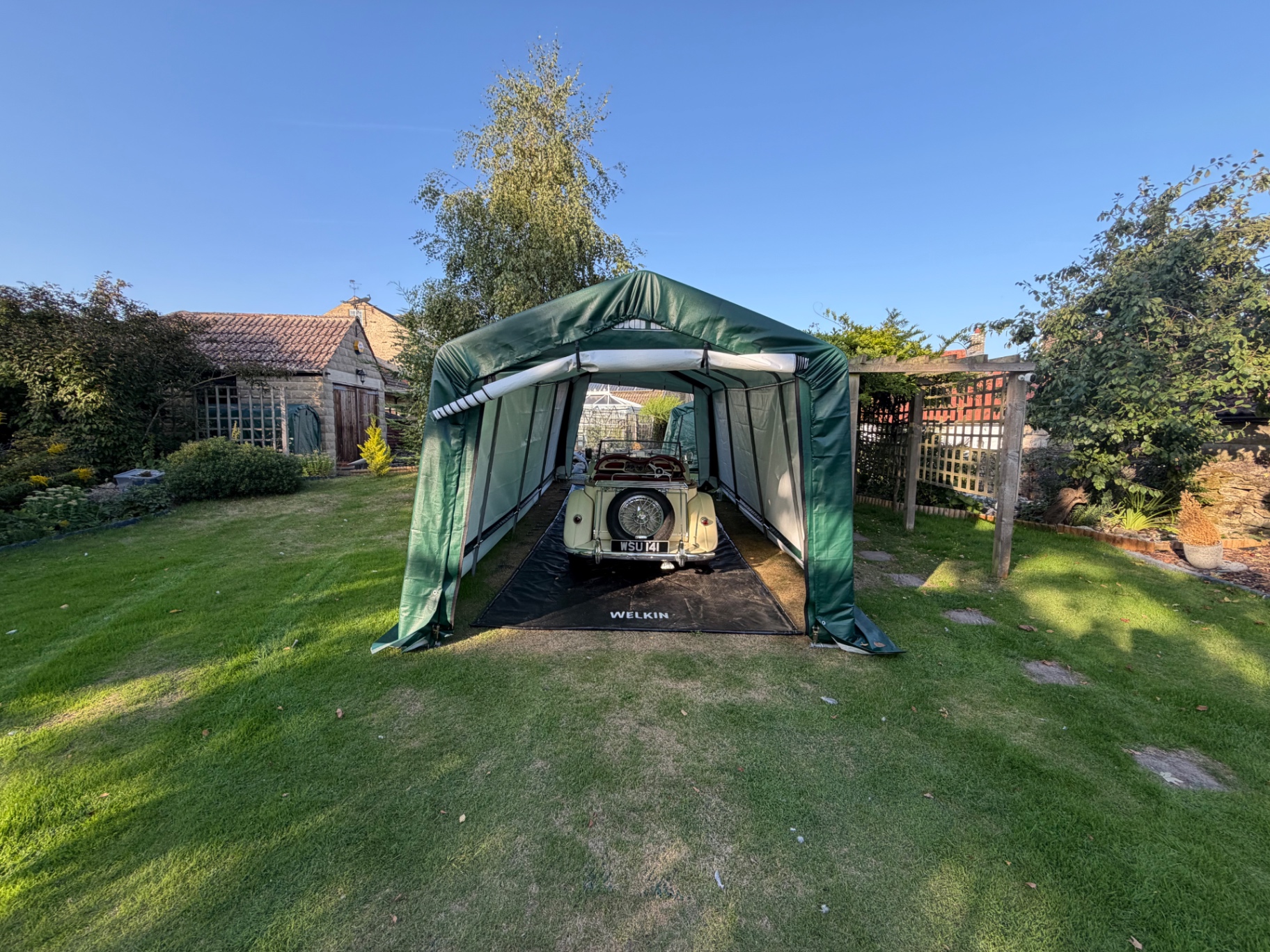 WSU 141, a 1954 MG TF 1500, under a Clarke portable shelter - rear view